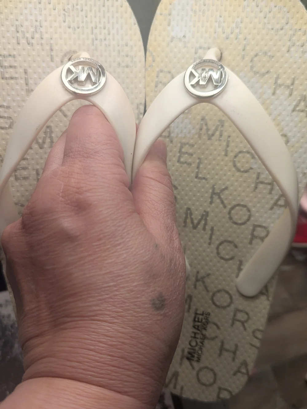 Michael Kors White Flip Flop with Silver MK Medallion
